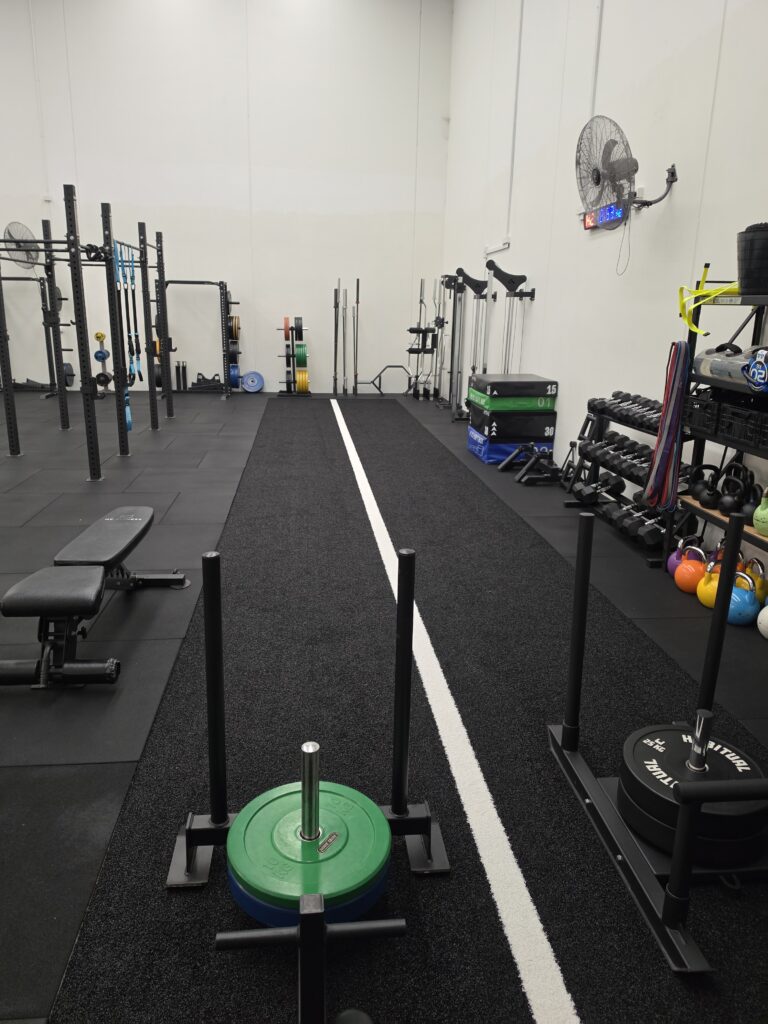Barbells, kettlebells and plyometric boxes in the Adapt Sports Physiotherapy rehabilitation gym.