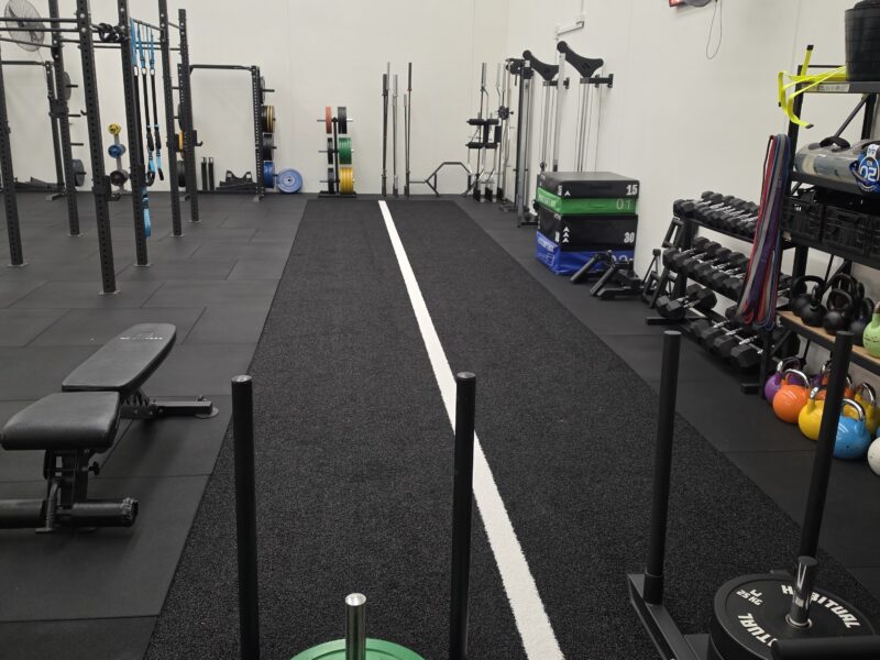 Barbells, kettlebells and plyometric boxes in the Adapt Sports Physiotherapy rehabilitation gym.
