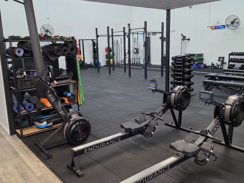 Rowing and cardio equipment in the Adapt Sports Physiotherapy rehabilitation gym.