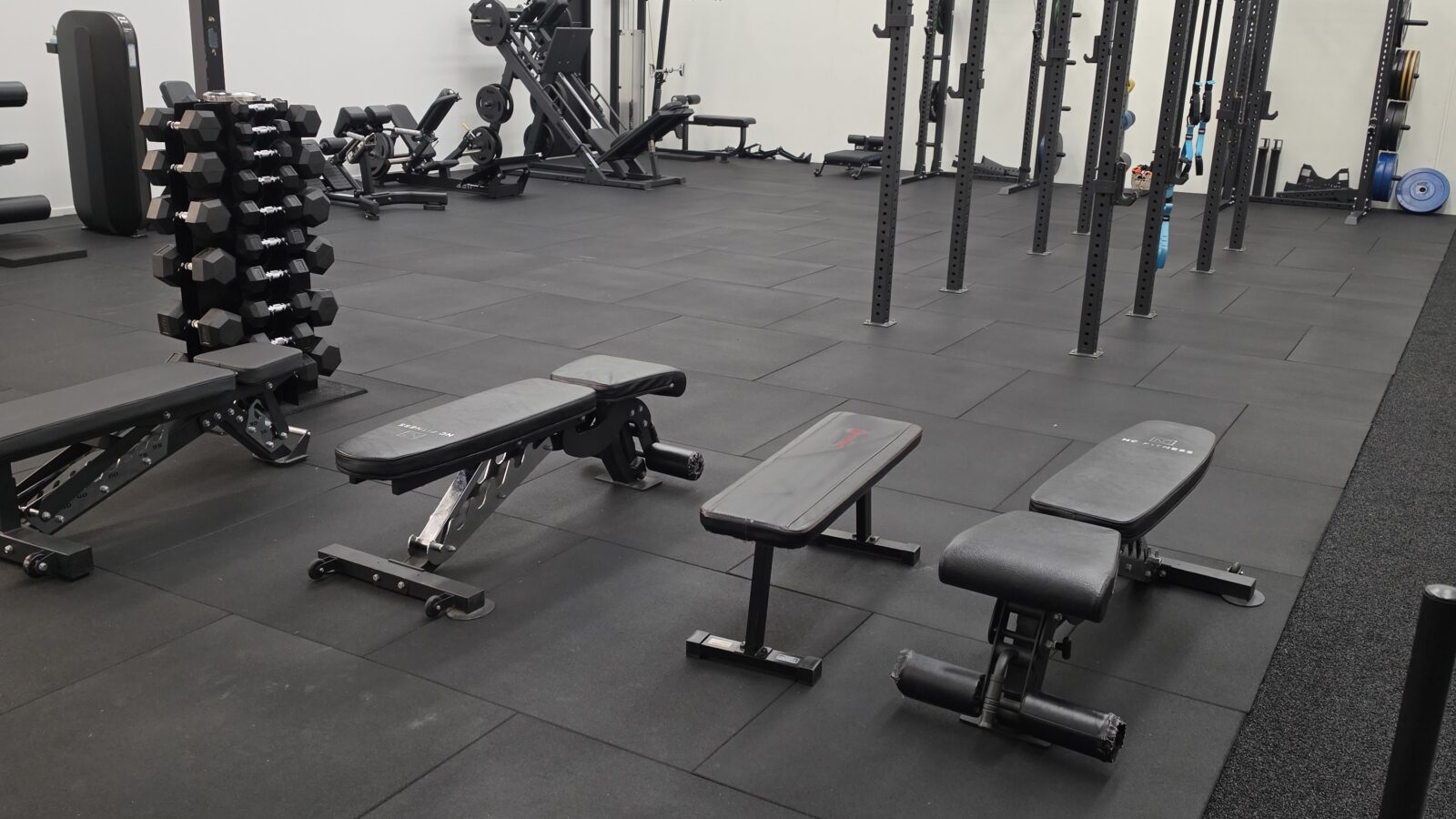 Squat racks and benches in the Adapt Sports Physiotherapy rehabilitation gym