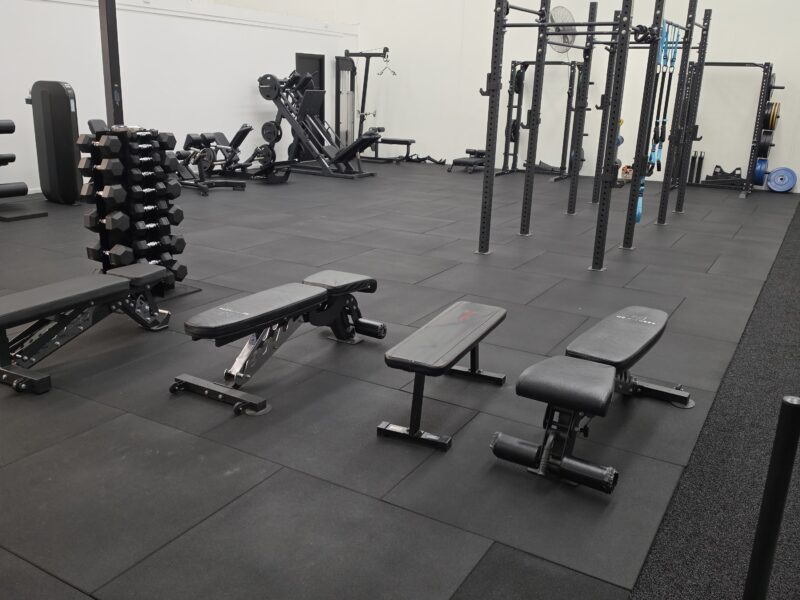 Squat racks and benches in the Adapt Sports Physiotherapy rehabilitation gym